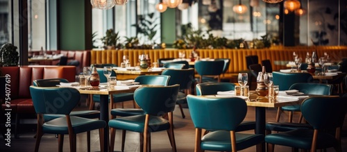 A restaurant is filled with numerous tables and chairs  creating a bustling atmosphere. Diners are seated  chatting  eating  and enjoying their meals in a lively setting.