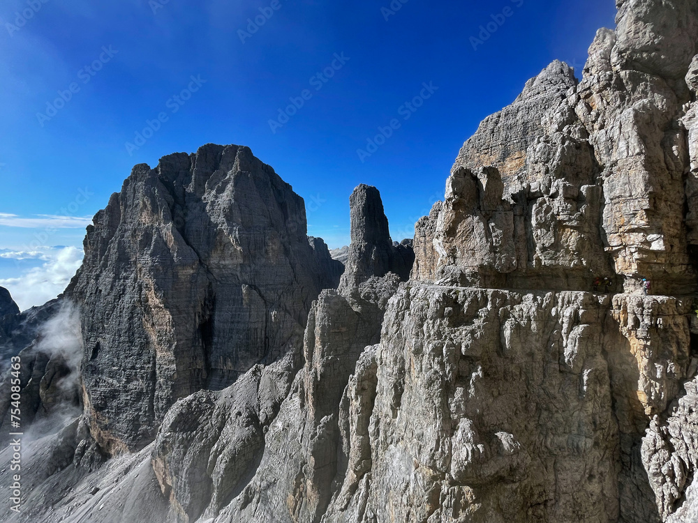 Fototapeta premium Aerial Perspectives: Exposed Trail Challenge in Adamello Brenta, Bocchette, Dolomites