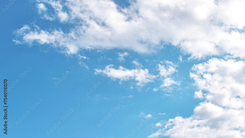 Blue sky with white fluffy cloud. Cumulus clouds. Summer season sky. Cloudscape background. Freedom of life, never give up and positive though energy concepts. Blue sky with white fluffy cloud. Cumulus clouds. Summer season sky. Cloudscape background. Freedom of life, never give up and positive though energy concepts.