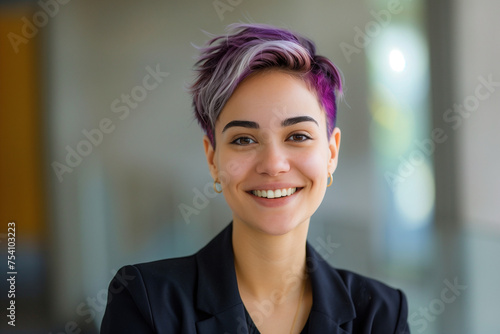 cool young woman with purple dyed short hair wearing black shirt portrait in modern office, diversity	
 photo