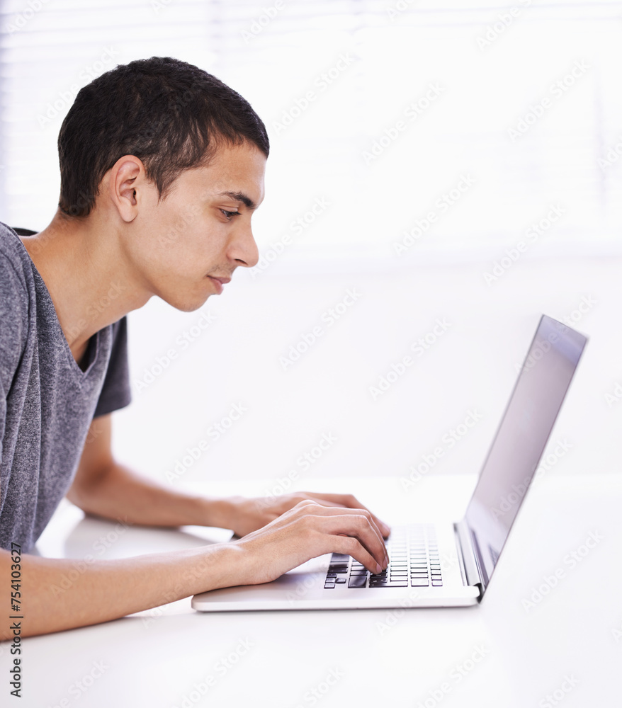 University, elearning and man typing on laptop for research, study and email with education, knowledge and opportunity. Computer, reading and college student writing report for online course at desk. University, elearning and man typing on laptop for research, study and email with education, knowledge and opportunity. Computer, reading and college student writing report for online course at desk.