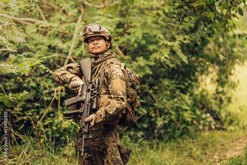 SEALs from the Army are frontline soldiers ready to fight and check on enemies on the battlefield. They wear military uniforms  have M16 rifles  helmets  and vision goggles. The terrain is forest.