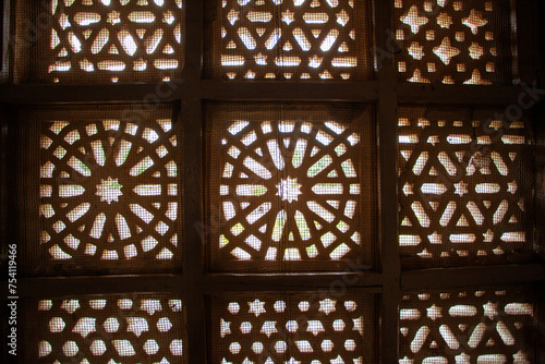 Intricate wooden lattice window design, Mandu, India photo