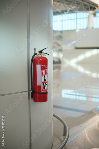 fire extinguisher on the wall © Iqrologo