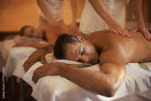 Couple, massage and treatment at spa with masseuse, wellness and zen for body care at luxury resort. Physical therapy, detox and holistic healing with people for stress relief, peace and service
