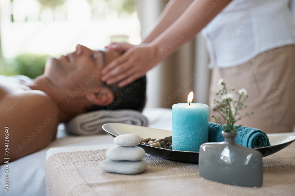 Luxury, facial massage and man relax in spa with aromatherapy candle for holistic treatment. Hotel, peace and health for male person, wellness and rest in resort for holiday for skincare in break - obrazy, fototapety, plakaty 