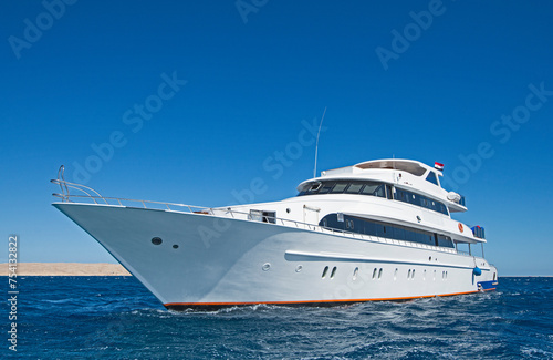 Luxury private motor yacht under way sailing at sea © Paul Vinten