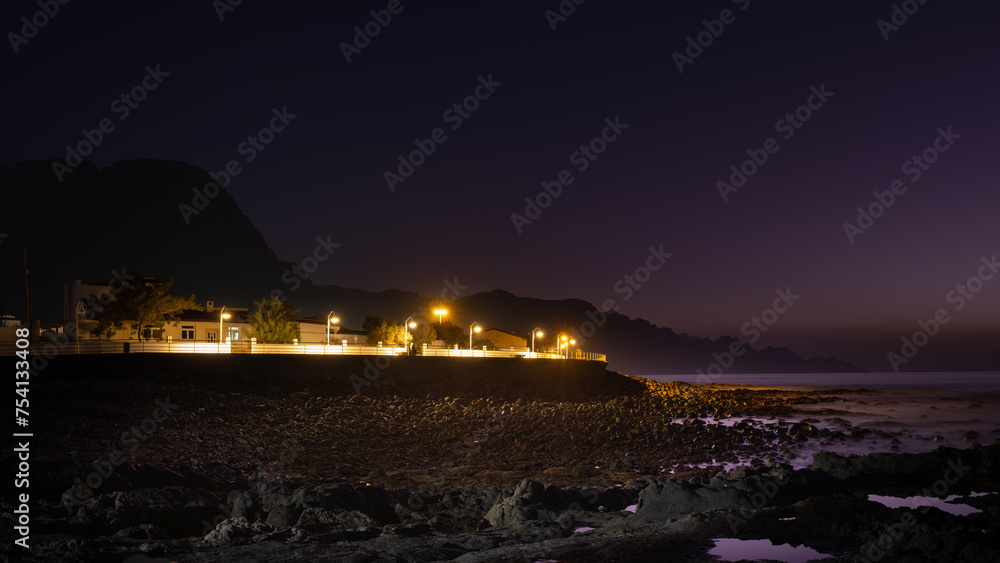 Buildings and waterfront of Puerto de las Nieves near Agaete in Gran Canaria, Spain. Long exposure nightime image