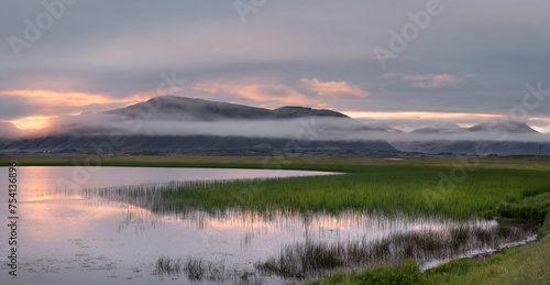 Colorful sunset, lake and scenic landscape of Icelandic countryside