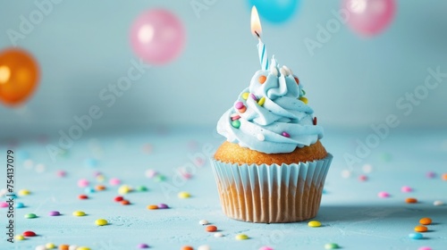 Delicious birthday cupcake with candle on light blue background. Space for text .
