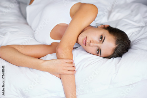 Morning, wake up and portrait of woman in bedroom with wellness, confidence and cozy in apartment. Face, home and girl in bed with peace, calm and relax for healthy sleep, comfort and natural rest.