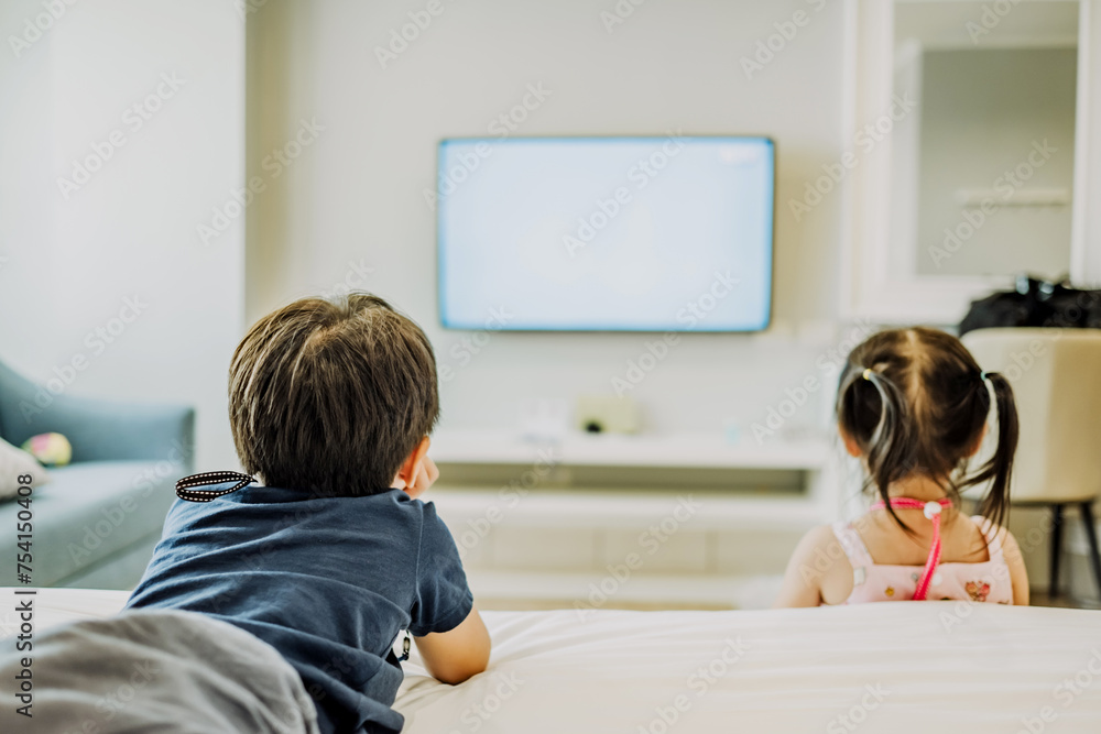 Little boy watching television at home. Copy space. Soft focus. Little boy watching television at home. Copy space. Soft focus.