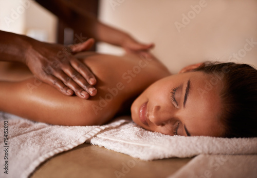 Hands, woman and sleep at spa for massage, wellness and skin care for back, chiropractic therapy or peace. Female person, relax and health for lifestyle, body or wellbeing on table, calm or natural