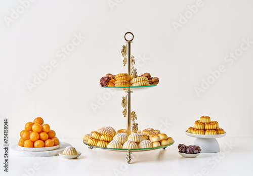 Assorted semolina maamoul or mamoul cookies , awameh or luqaimat with ramadan decor crescent moon . Traditional middle eastern desserts