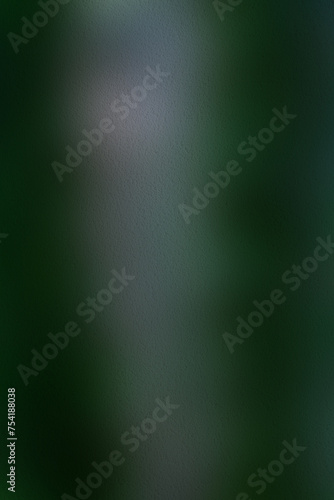 A blurr texture background of dark green to lighter green hues  giving it a mysterious and enigmatic aura