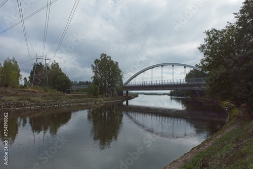 Ahvenkoski bridge over river in cloudy weather in summer, Pyhtää, Finland. © Raimo