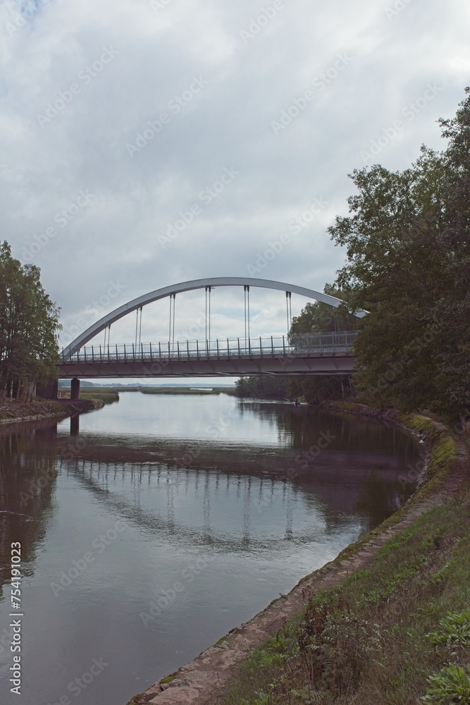 Ahvenkoski bridge over river in cloudy weather in summer, Pyhtää, Finland.