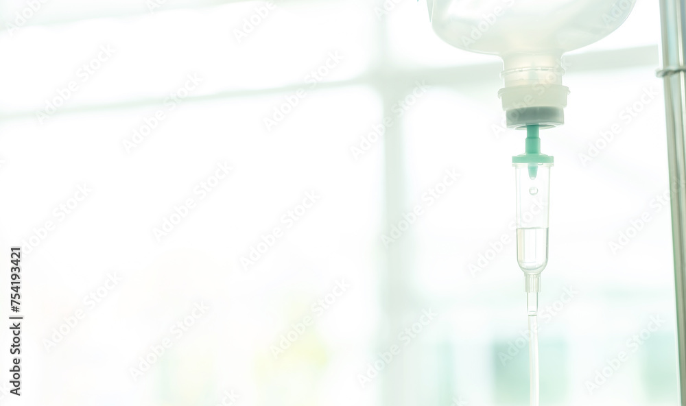 Saline intravenous (IV) drip for patient in hospital., Medical Concept, treatment emergency. Copy space. Soft focus. Saline intravenous (IV) drip for patient in hospital., Medical Concept, treatment emergency. Copy space. Soft focus.