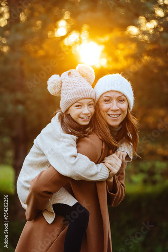 Mother and daughter smiling and hugging