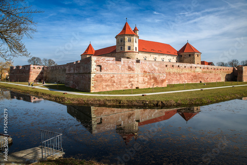 Water reflection with Fagaras Citadel Fortress in Brasov Romania