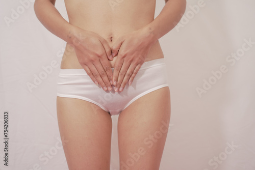 Photography Close-up of woman wearing white panties On a white background about menstruation, cervical cancer, ovarian cancer