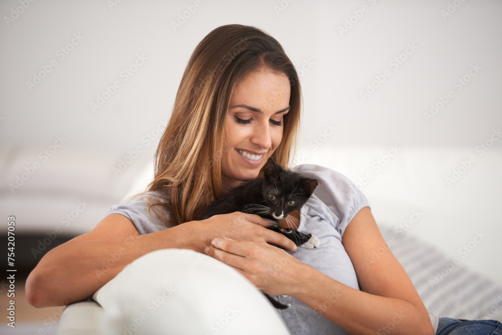 Kitten, woman and smile on couch for animal or pet for cute and adorable in hands for play and friends. Young person and relax with cat for paw and scratch with gentle, care and touch for love Kitten, woman and smile on couch for animal or pet for cute and adorable in hands for play and friends. Young person and relax with cat for paw and scratch with gentle, care and touch for love