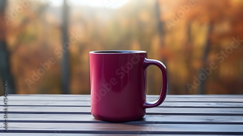 Close up of a burgundy Mug on a wooden Table in a Forest. Blurred natural Background