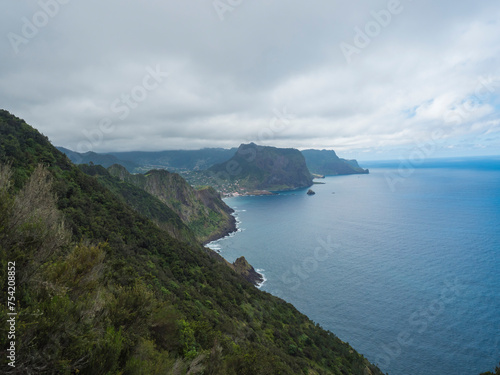 Views from Vereda do Larano coastal hiking trail. Cliffs atlantic ocean and green tropical vegetation. Madeira island, Portugal, Europe.