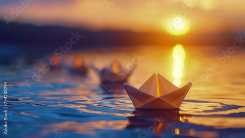 Golden sunset over the water with paper boats creating a tranquil and reflective mood