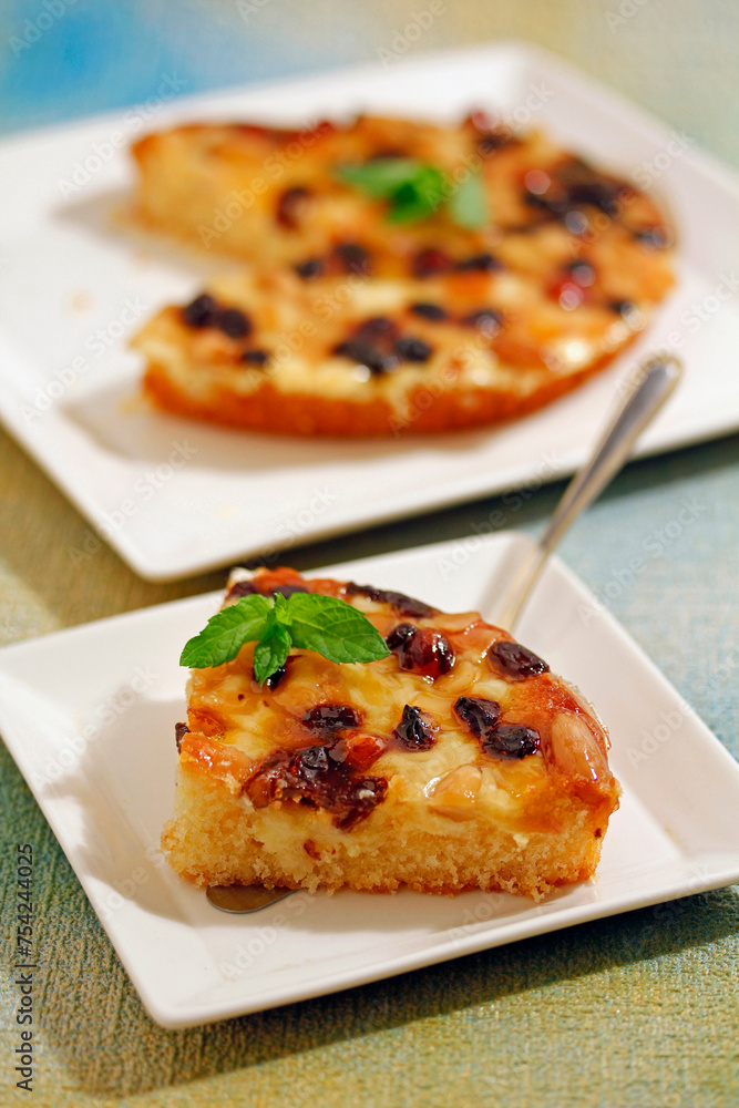 Tart with walnut, raisins, and almonds. Tart with walnut, raisins, and almonds.