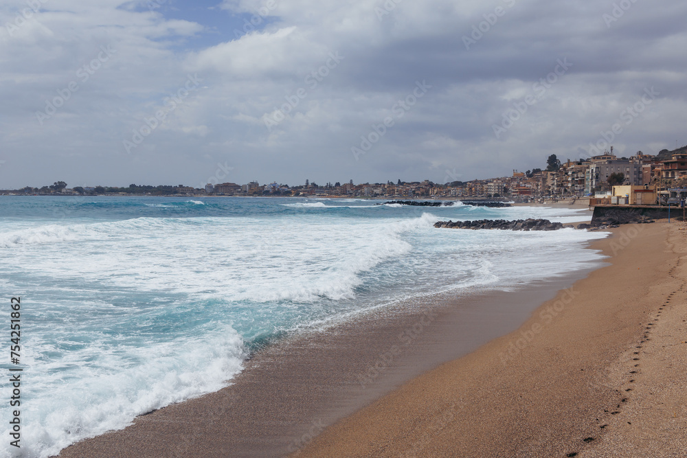 Beach in Giardini Naxos in the Metropolitan City of Messina on the island of Sicily, Italy