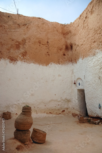 Courtyard of traditional Berber cave dwelling near Matmata city, Kebili Governorate, Tunisia photo