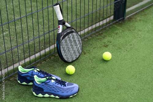 Padel tennis racket sport court and balls. Download a high quality photo with paddle for the design of a sports app or soical media advertisement