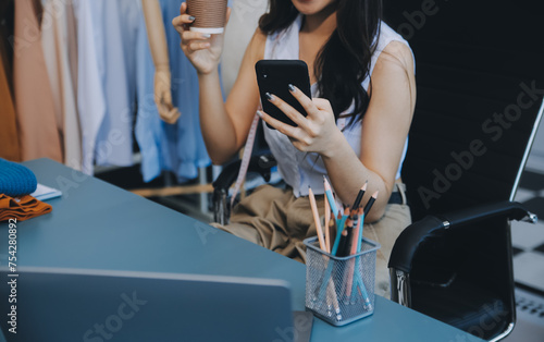 Young woman small business owner working at home office. Online marketing packaging delivery, startup SME entrepreneur or freelance woman concept. Small business owener photo