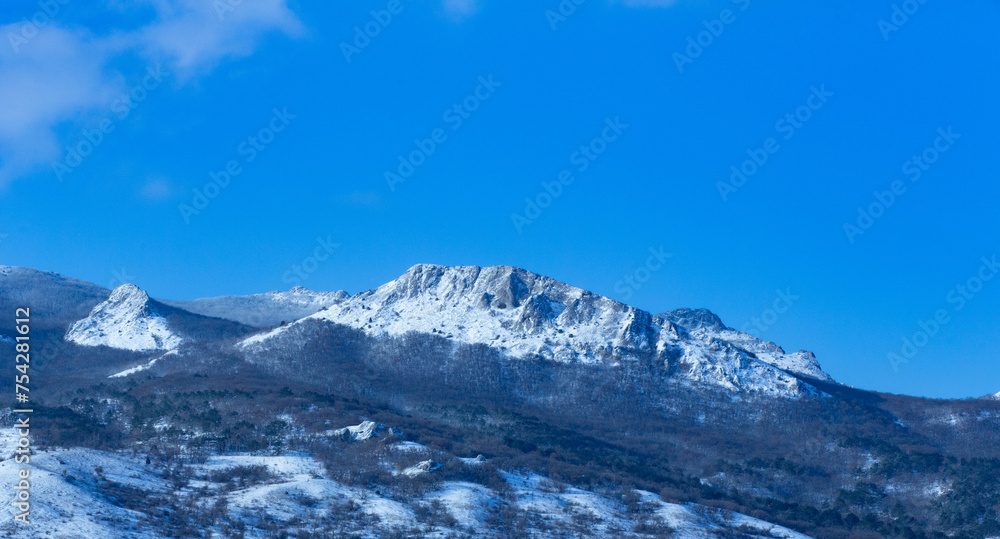 Winter sunny day in the mountains under the blue sky. Crimea.