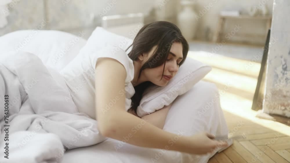 Pretty young woman using smartphone gadget for checking morning news and notifications after wake up on sofa at home Upset female reading negative information on cellphone Bad message concept Pretty young woman using smartphone gadget for checking morning news and notifications after wake up on sofa at home Upset female reading negative information on cellphone Bad message concept