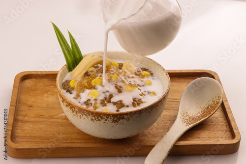 Thai Dessert, Sago or Tapioca Pearls Pudding with Corn and Coconut Milk. photo