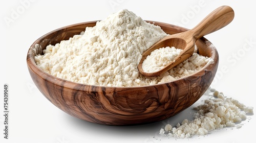 a flour coated spoon within a wooden bowl brimming with rice or wheat flour on white background  