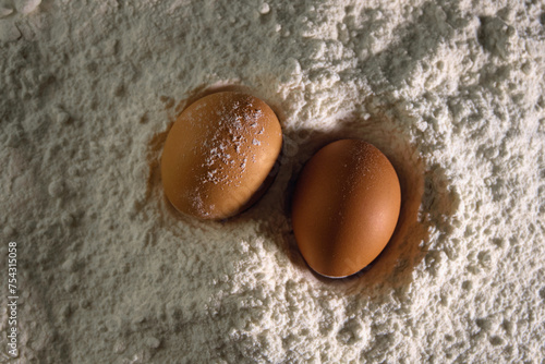 chicken eggs lie in flour close-up