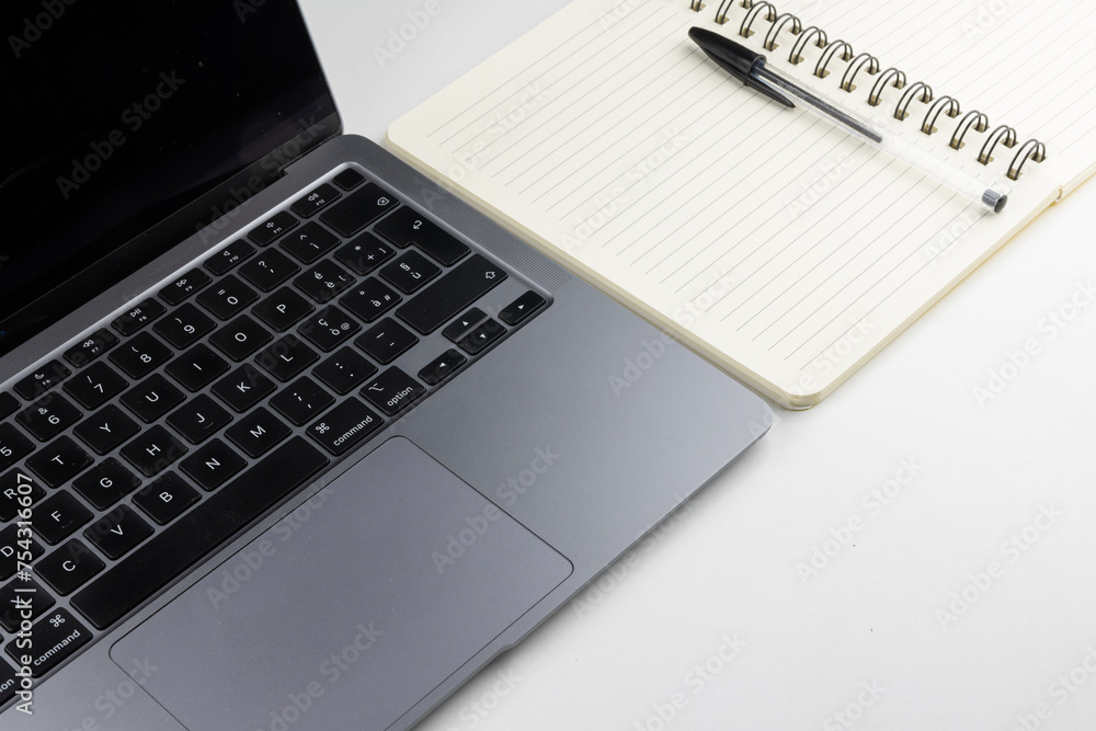 Laptop with block notes and pen Laptop with block notes and pen