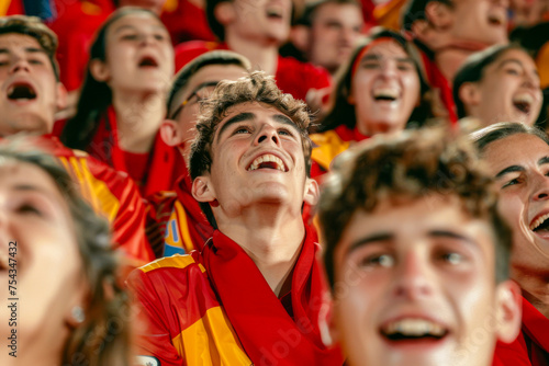 Spanish football soccer fans in a stadium supporting the national team, La Selección, La Furia Roja 