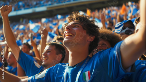 Italian football soccer fans in a stadium supporting the national team, Squadra Azzurra
 photo
