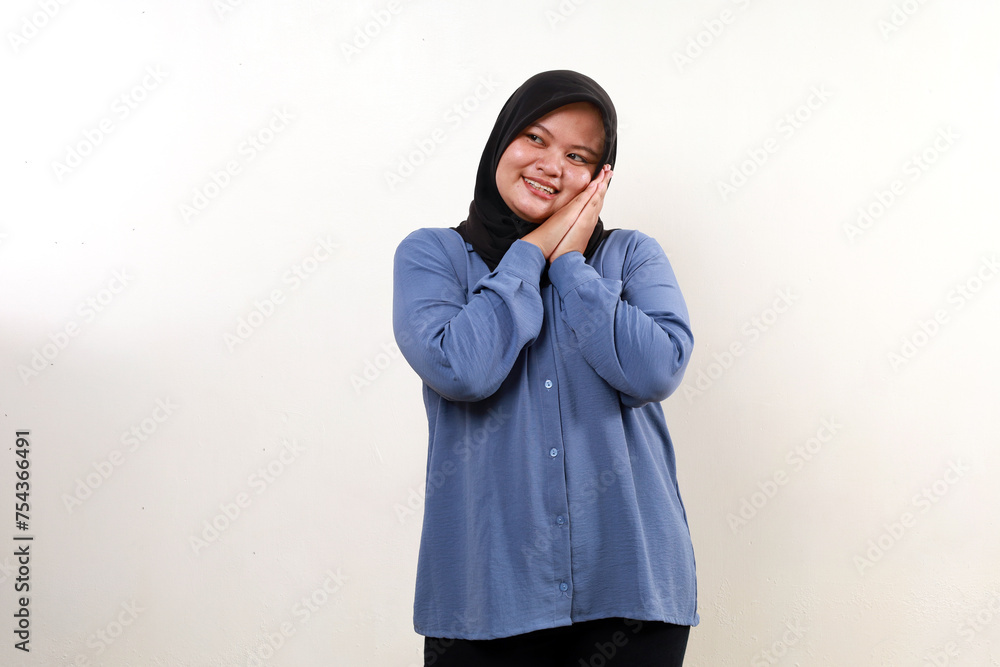 Happy smile asian muslim woman standing while admiring something. Isolated on white Happy smile asian muslim woman standing while admiring something. Isolated on white