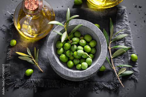 Green and ripe olives as a source of good oil. photo
