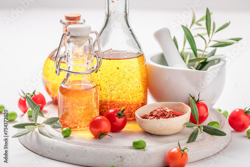 Fresh and healthy oil in bottle with dried tomatoes.