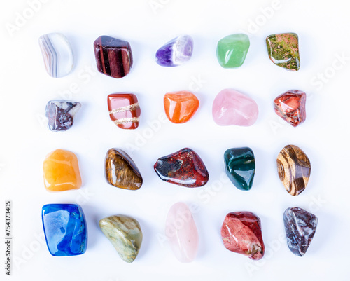Semi-precious multi-colored stones, minerals on a white background close-up. Mineralogy. Collection of minerals.