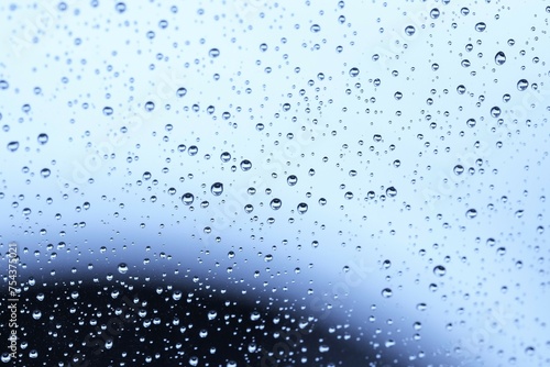 Raindrop Rhythms: Abstract Water Patterns on Glass,
