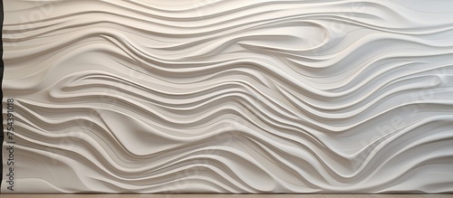 This close-up shows a white wall with wavy lines that create a textured and dynamic surface. The wall features 3D elevation tiles with a unique design,