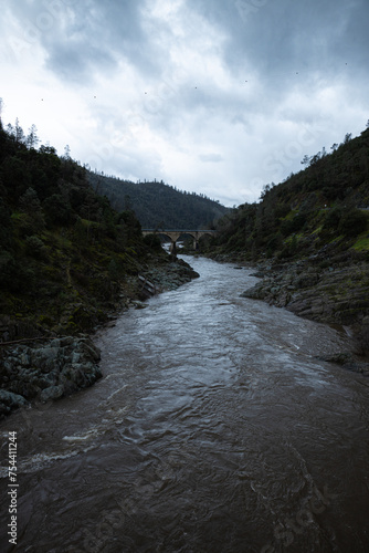 mountain river in the mountains with bridge crossing