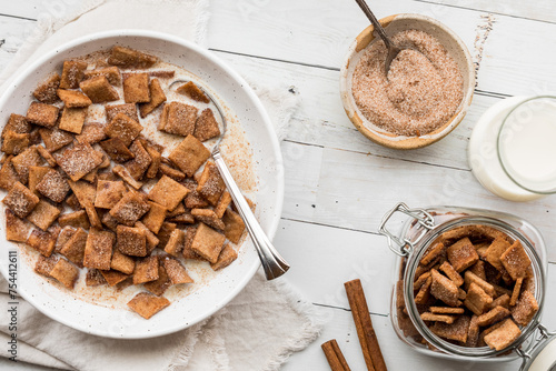 Above view of homemade cinnamon toast crispy cereal served with milk